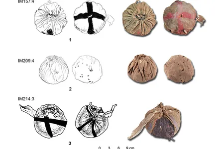 Three 3,000-year-old balls discovered at the Yanghai cemetery complex in Xinjiang
