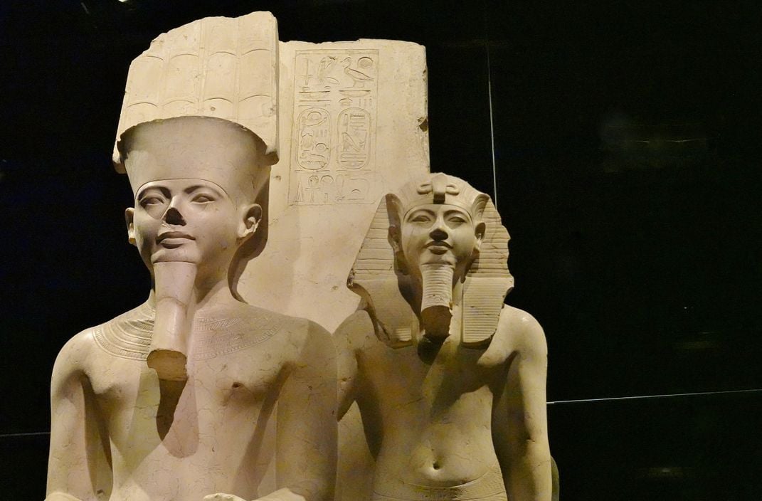 Statue of the pharaoh Horemheb (right) with the god Amun (left)