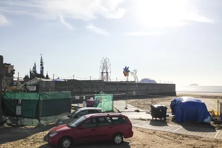Weston-super-mare, United Kingdom. 18th August 2015 -- A structure of a sinister fairy castle can be seen in Weston-super-Mare. High security has been put in place. Image courtesy of Martyn East on Instagram. -- Fans of street artist Bansky expect whispers of a secret sinister pop-up exhibition called 'Dismaland' in seaside town to be true. A fairy castle structure, like a sinister twist on Disneyland, can be seen by locals from Weston-super-mare beach.