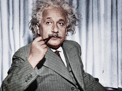 Albert Einstein, pondering the mysteries of the universe—or maybe just writing a killer tweet.