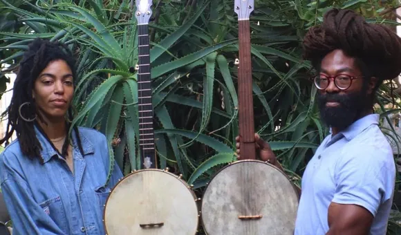 Black Banjo Reclamation Project founders Hannah Mayree and Carlton “Seemore Love” Dorsey, with banjos made by Brooks Masten of Brooks Banjos in Portland, Oregon. (Photo by Avé-Ameenah Long)