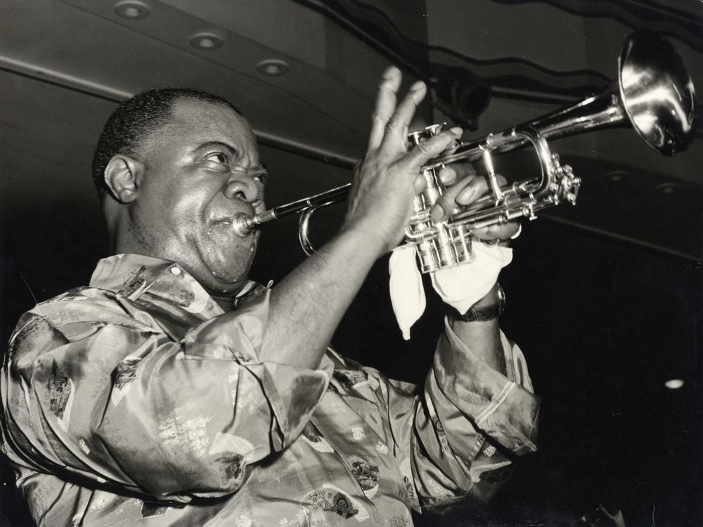 Louis Armstrong playing his trumpet