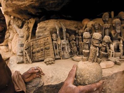 Dogon region villager with ritual figures