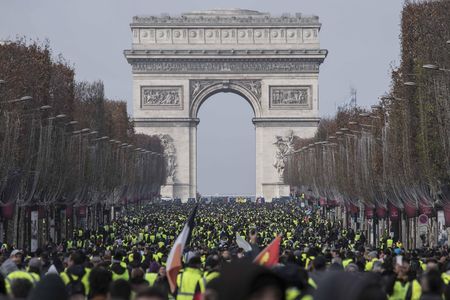 Thousands of yellow vest protesters seen in front of the Arc De Triomphe on December 8, 2018.