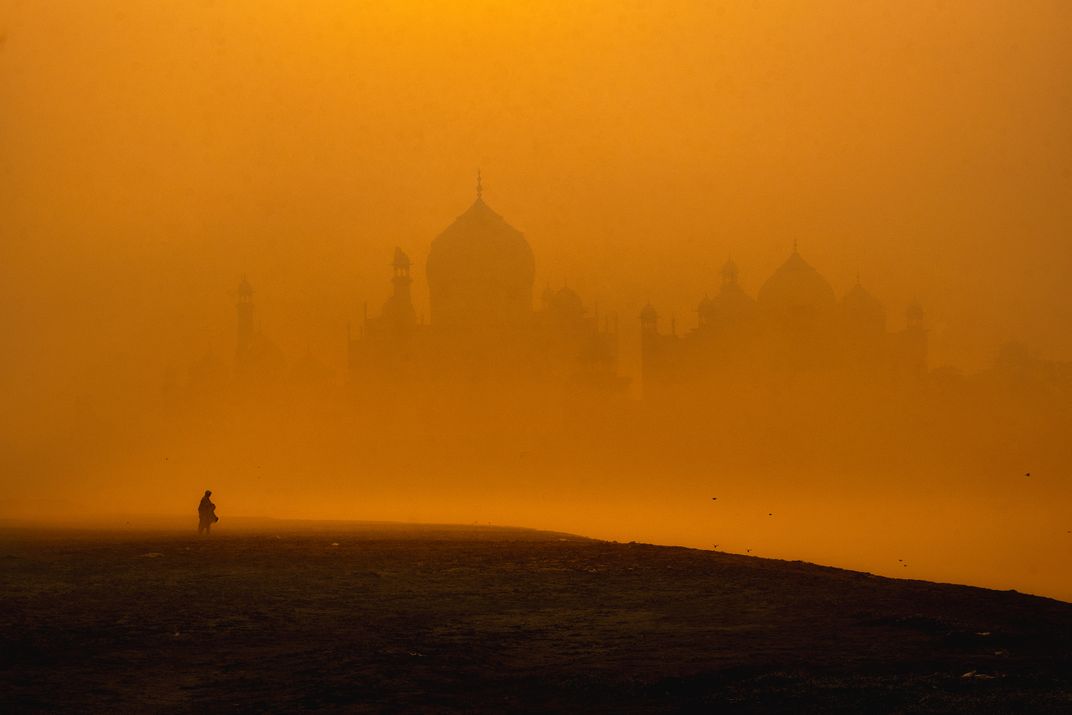 15 - The Taj Mahal, built in the 17th century, is a universally admired masterpiece of architecture. Although it’s barely visible here through the dust and sand, the silhouette of its distinct shape is unmistakable.