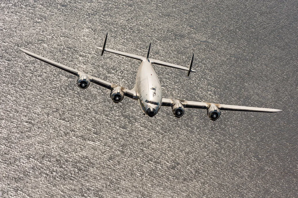 Lockheed Constellation over a lake in monochrome