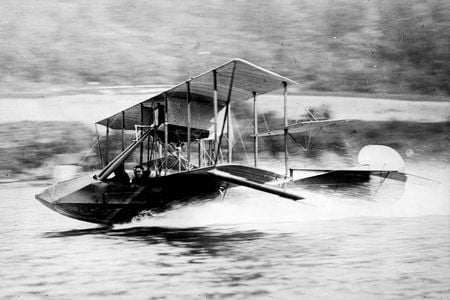 Gustave Maurice Heckscher, a real estate developer and pilot, flew a Curtiss Model F seaplane across a lake in 1913. The U.S. Navy used the two-seat Model F, with a top speed of 65 mph, to train pilots serving in World War I.