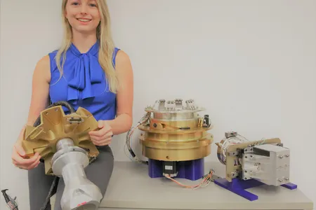 Surrounded by robotic tools for assembling satellites in space, Megan Smith looks forward to the day when a crewed habitat will orbit the moon.