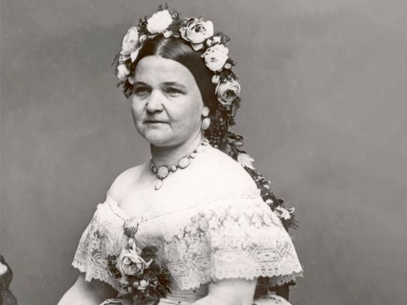 A black-and-white portrait of Mary Lincoln wearing flowers in her hair