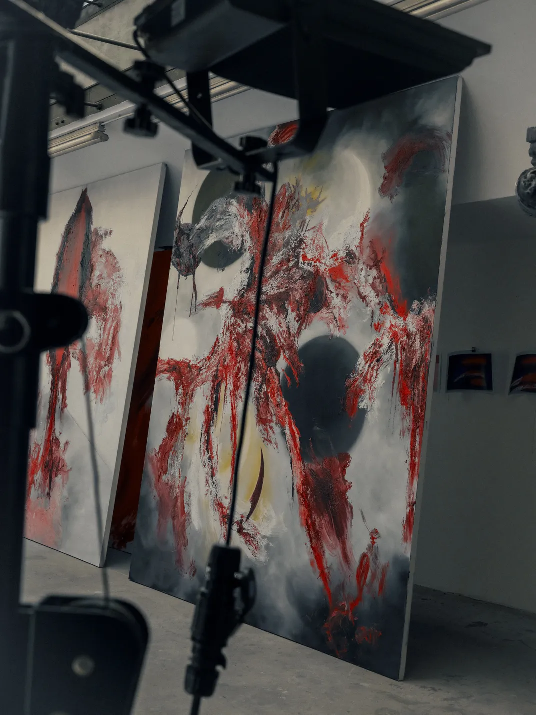 black white and red painting in studio