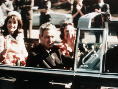 President John F. Kennedy, First Lady Jacqueline Kennedy and Texas Governor John Connally ride through the streets of Dallas, Texas on November 22, 1963, the day of Kennedy’s assassination.