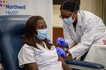 Sandra Lindsay, an intensive care nurse with Northwell Health, was the first person known to receive the approved vaccine in the United States on December 14, 2020.