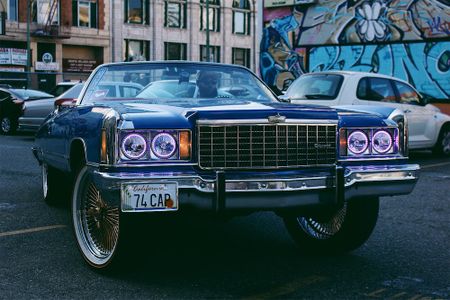 DropReg, President of the East Bay Chevs group, in his ride during a video shoot in downtown Oakland. 
