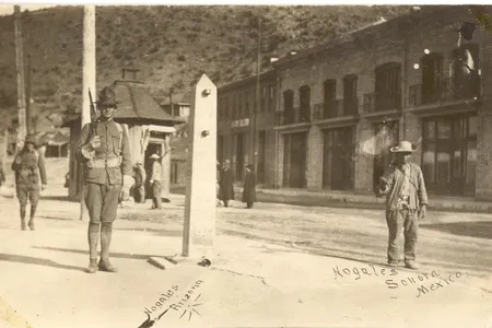 A metal obelisk marked the international border in Ambos Nogales circa 1913. American (left) and Mexican (right) sentries patrolled the line.