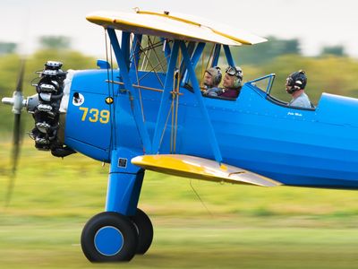 people in a blue aircraft