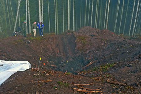 A team excavates the site near Allmuthen, Belgium where a U.S. Army Air Forces B-26 crashed 68 years ago.