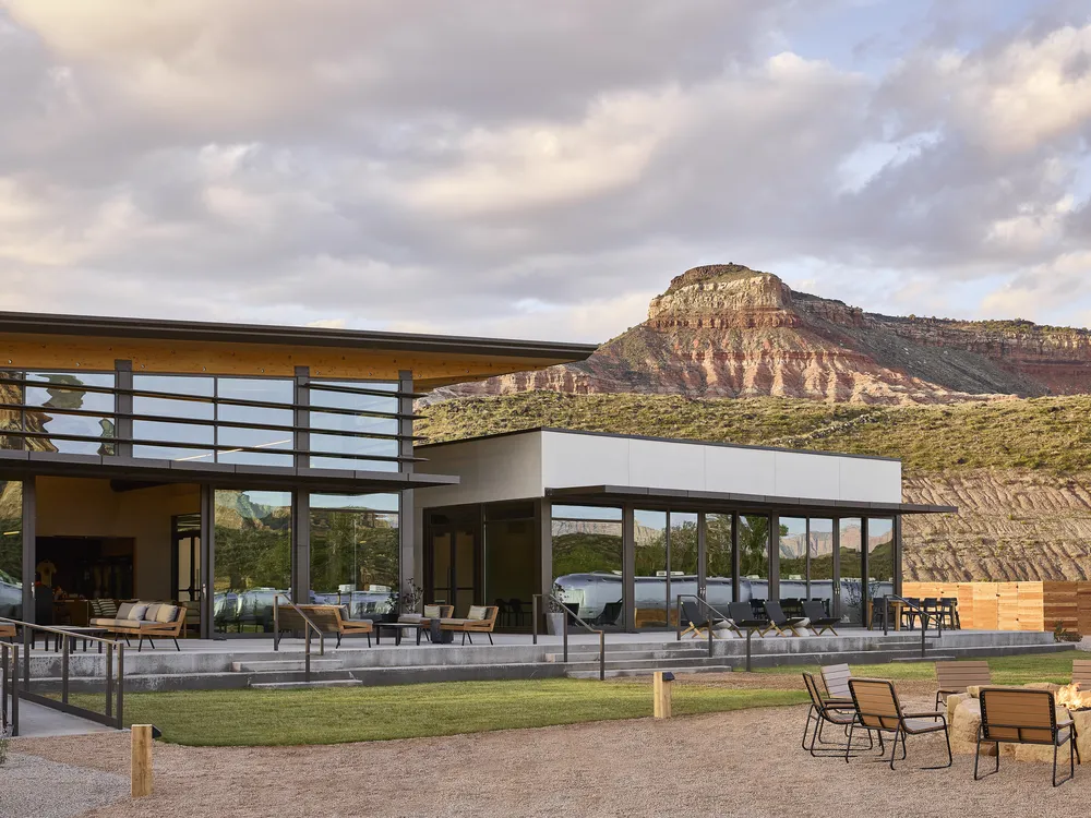 Glamping resort clubhouse with sandstone rock formation behind