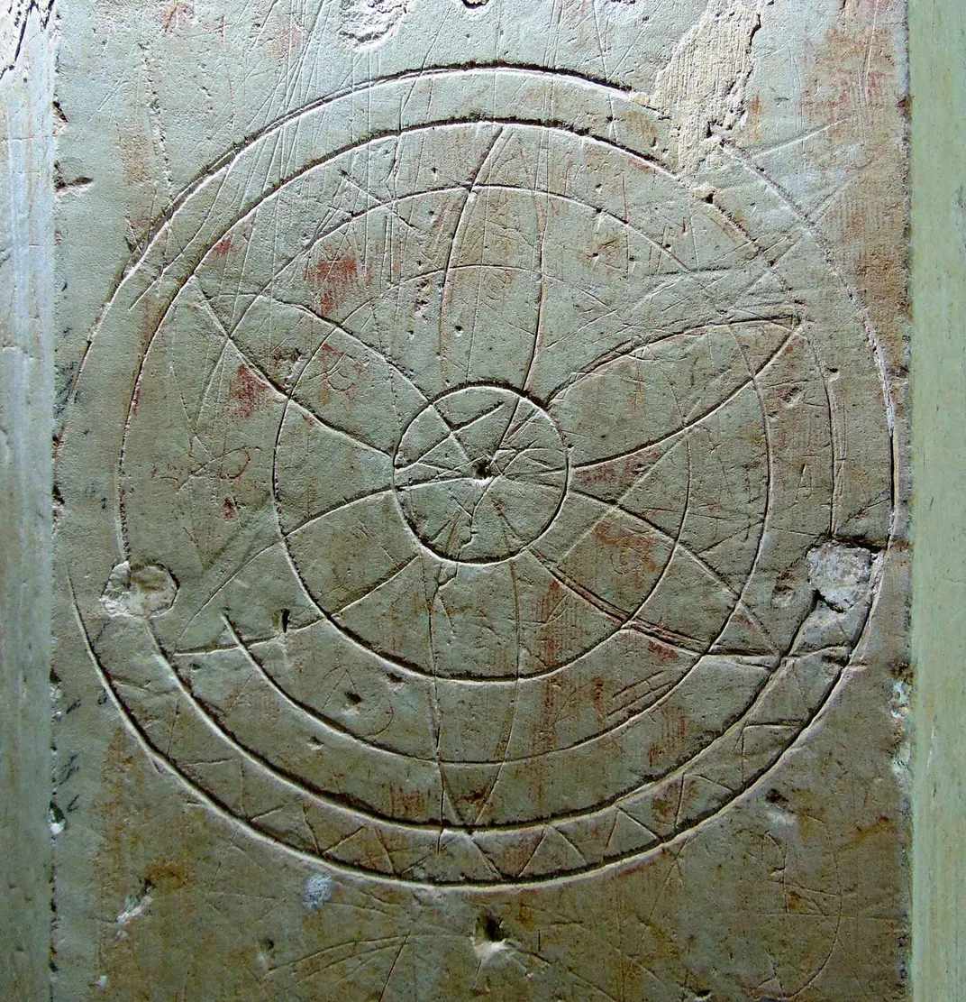 A hexafoil marking on the wall of a church in England