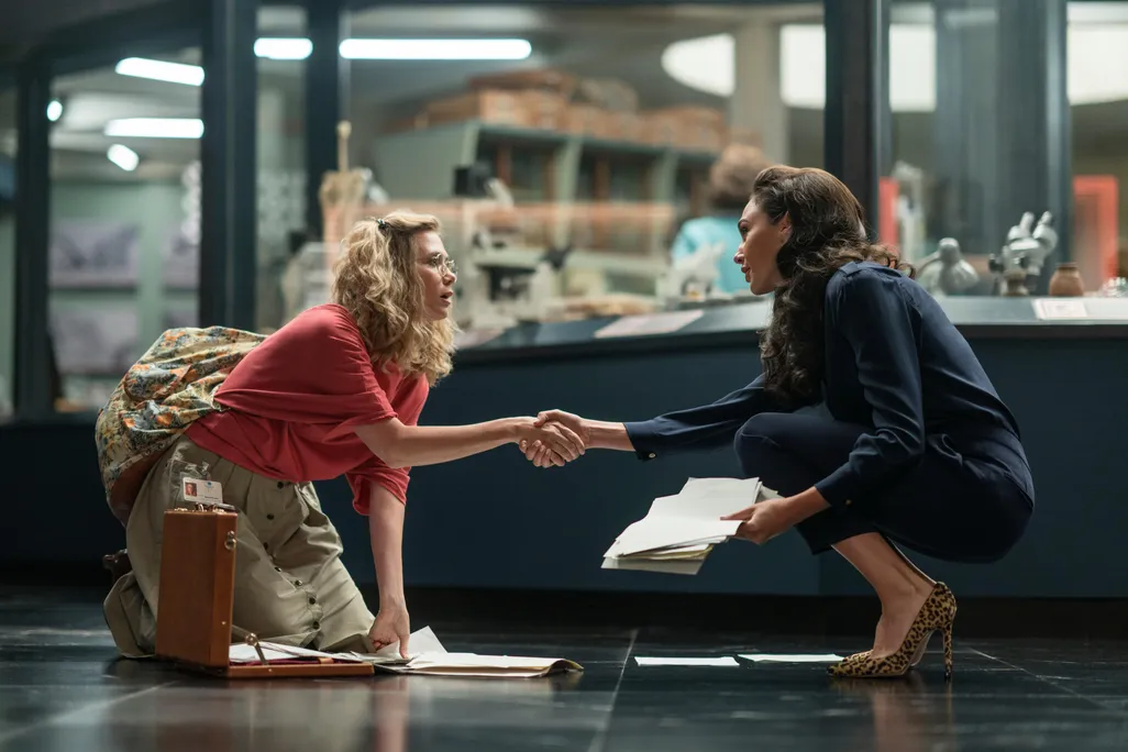 Barbara Minerva shakes hands with Wonder Woman