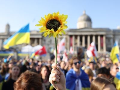 A protester holds a sunflower during a London rally in support of Ukraine on March 26, 2022.