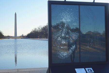 Artist Simon Berger created the portrait by strategically hammering cracks into a pane of glass.