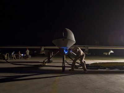 Lt. Col. Geoffrey Barnes, Detachment 1 46th Expeditionary Reconnaissance Attack Squadron commander, performs a pre-flight inspection of an MQ-1B Predator unmanned drone aircraft in September 3, 2008.