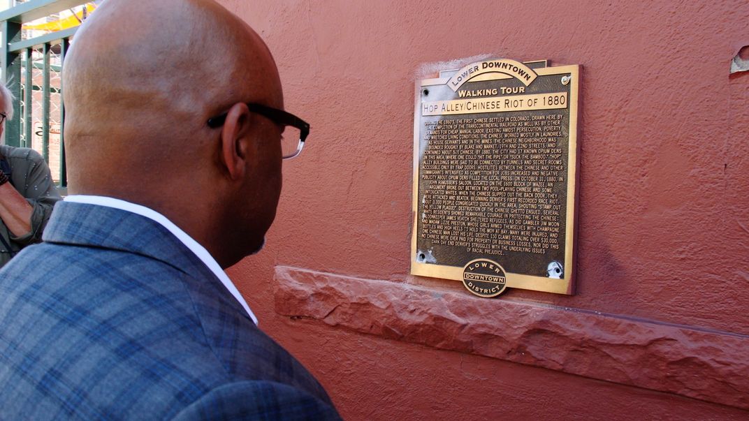 Denver mayor reading plaque
