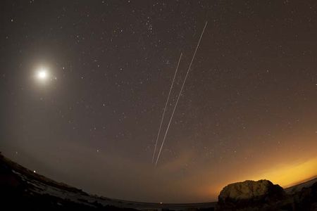 ISS and space shuttle Discovery STS-133) orbiting together on what was Discovery's  final flyover over Pacific Grove and the Monterey peninsula.