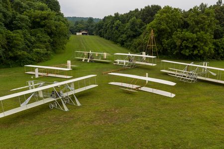 Ken Hyde’s collection, arrayed near his workshop (clockwise from top, left): 1911 Model B; 1909 Military Flyer; 1910 transitional Flyer; 1902 glider; 1911 EX Vin Fiz; 1911 glider (not shown: a second 1909 Flyer).