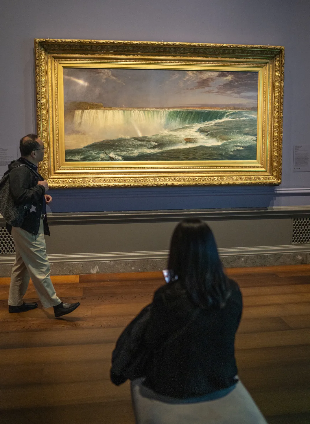 Visitors view Church's 1857 painting Niagara