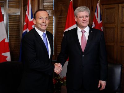 Australian Prime Minister Tony Abbott (L) with Canadian Prime Minister Stephen Harper (R) on June 9, 2014