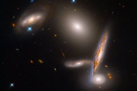 The Hickson Compact Group 40 features five galaxies caught in a gravitational dance.