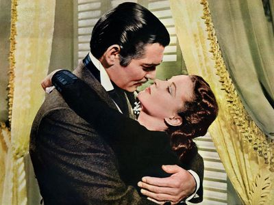 Rhett Butler (Clark Gable) embraces Scarlett O'Hara (Vivien Leigh) in a famous scene from the 1939 epic film Gone with the Wind.