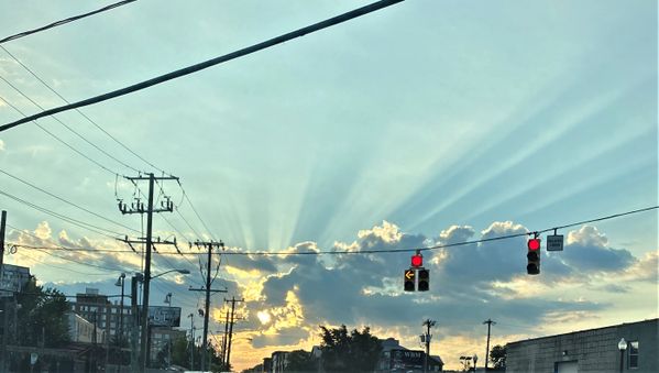 Unusually straight rays extending from a setting sun noticed while driving in Arlington.. thumbnail