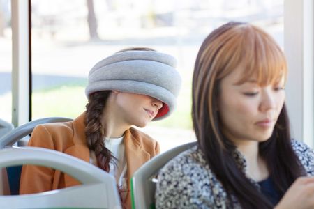 Looking for a unique, useful gift for a traveler on your list? The Ostrich pillow may look unusual, but it's great for catching up on rest.