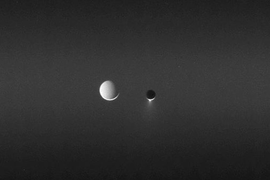 Two of Saturn's satellites, side by side.