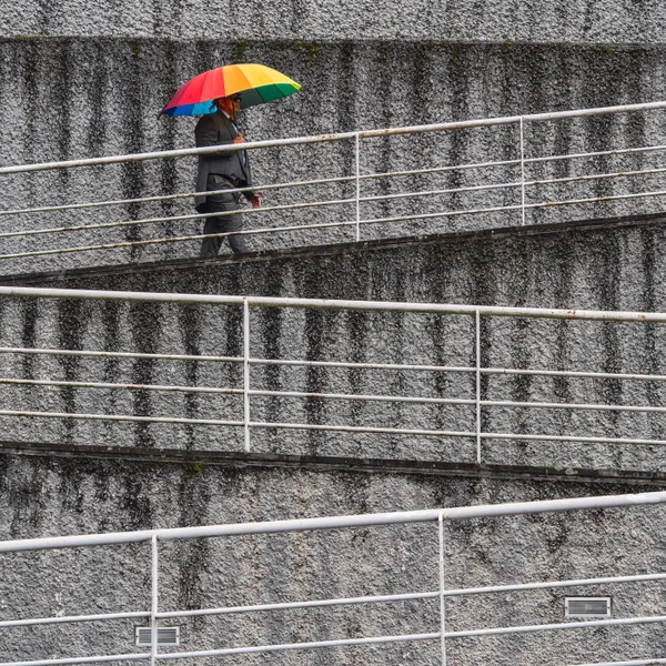 A man with a rainbow umbrella, Quito, Ecuador thumbnail