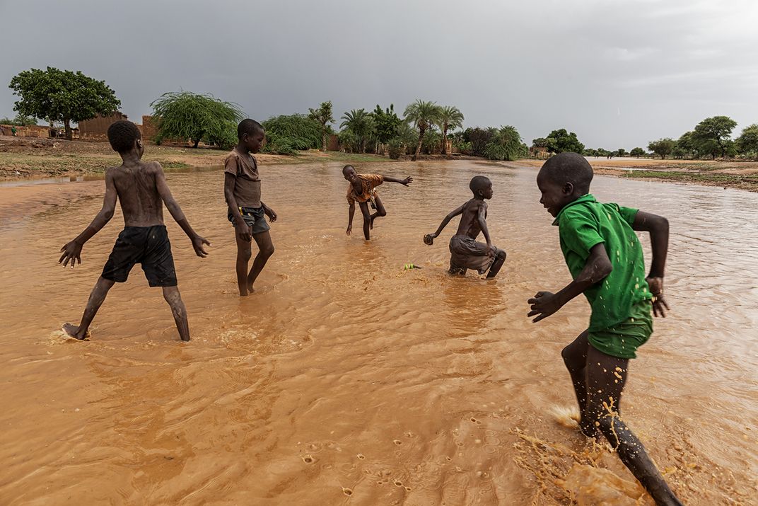 Kids playing in flooded Bani | Smithsonian Photo Contest | Smithsonian ...