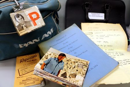 A selection of items from the Papers of Tom Brokaw, including a Pan Am flight bag filled with press passes to historic events, a reporter’s notebook, candid snapshots from NBC News productions, Brokaw’s personal copy of the transcript of taped Nixon conversations, with Brokaw’s handwritten notes.

 