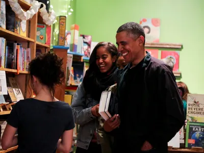 Former U.S. president Barack Obama goes book-shopping with his daughters in Washington, DC in 2015.