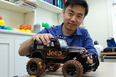 Wang with the toy jeep