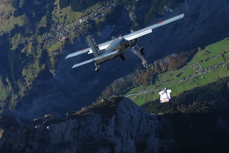 A French freeflying champion who is either Frédéric Fugen or Vincent Reffet chases a Pilatus Porter over Switzerland.