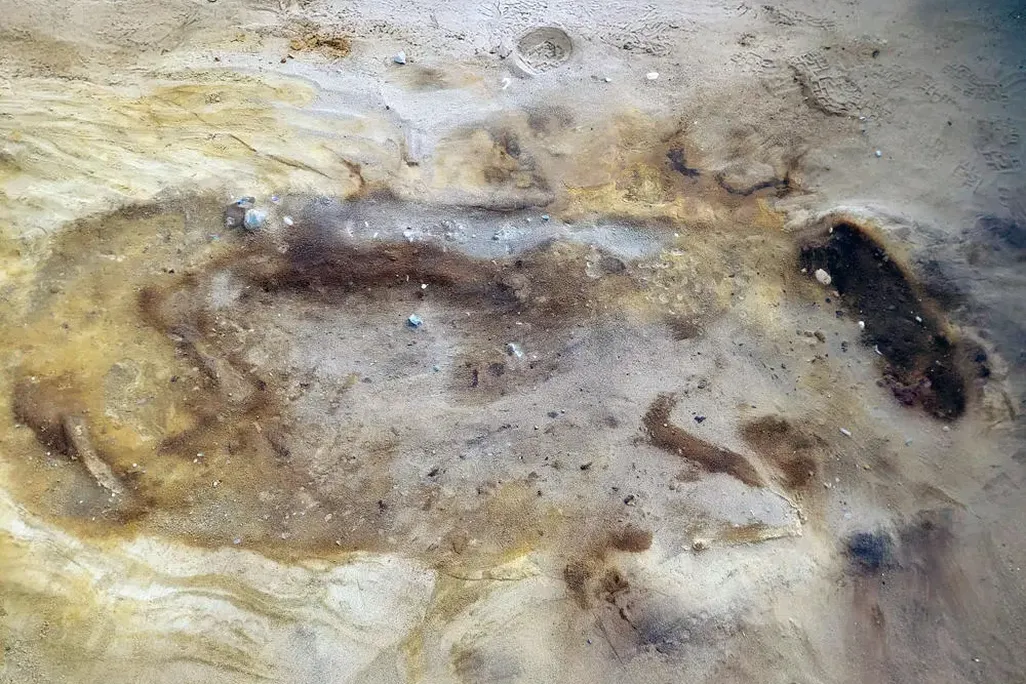 Grave site that contains the remains of two humans and one horse