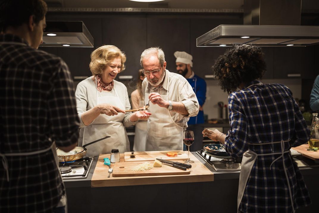 Sampling the recipe during a cooking class