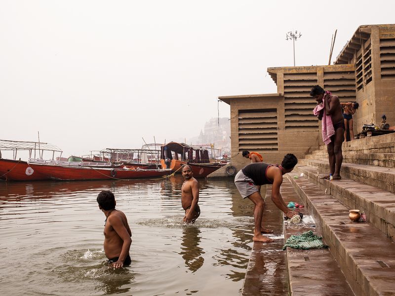 believers bathing into the Ganges river in Varanasi Smithsonian Photo