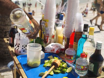 Mixing caipirinhas, the popular Brazilian cocktail made with cachaça, on Ipanema Beach.