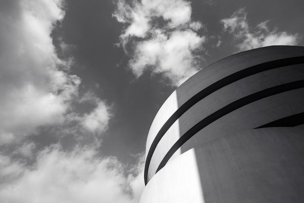Contrast formed by light and shadow. The photo shows black and white stripes on the building of Solomon R. Guggenheim Museum.