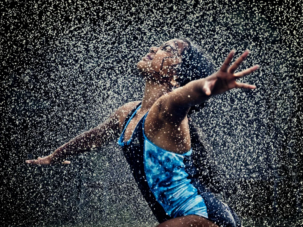 A girl in sprinklers