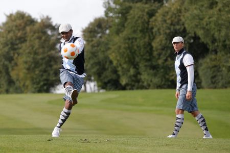 Former Brazilian soccer player Valdo kicks a ball down the footgolf green in Bellefontaine near Paris — October 2013.