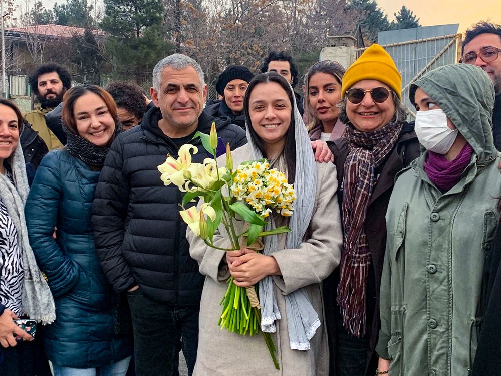 Iranian actress Taraneh Alidoosti (C) is welcomed by friends and colleagues on January 4, 2023, upon being released from prison on bail, after the authorities held her for almost three weeks over her support for the protest movement, her lawyer said